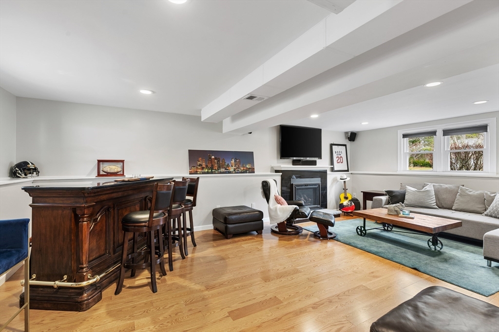 16 Bear Hill Road Billerica, MA 01821 - Photo 17 of 28 a living room with furniture gym equipment and a flat screen tv