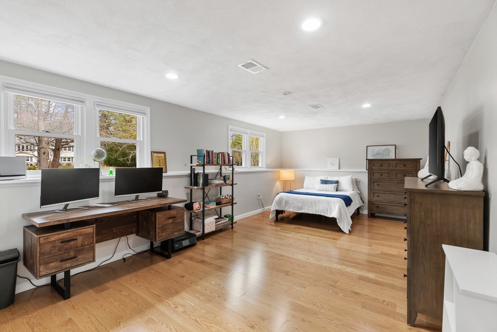 16 Bear Hill Road Billerica, MA 01821 - Photo 18 of 28 a living room with furniture flat screen tv and piano table