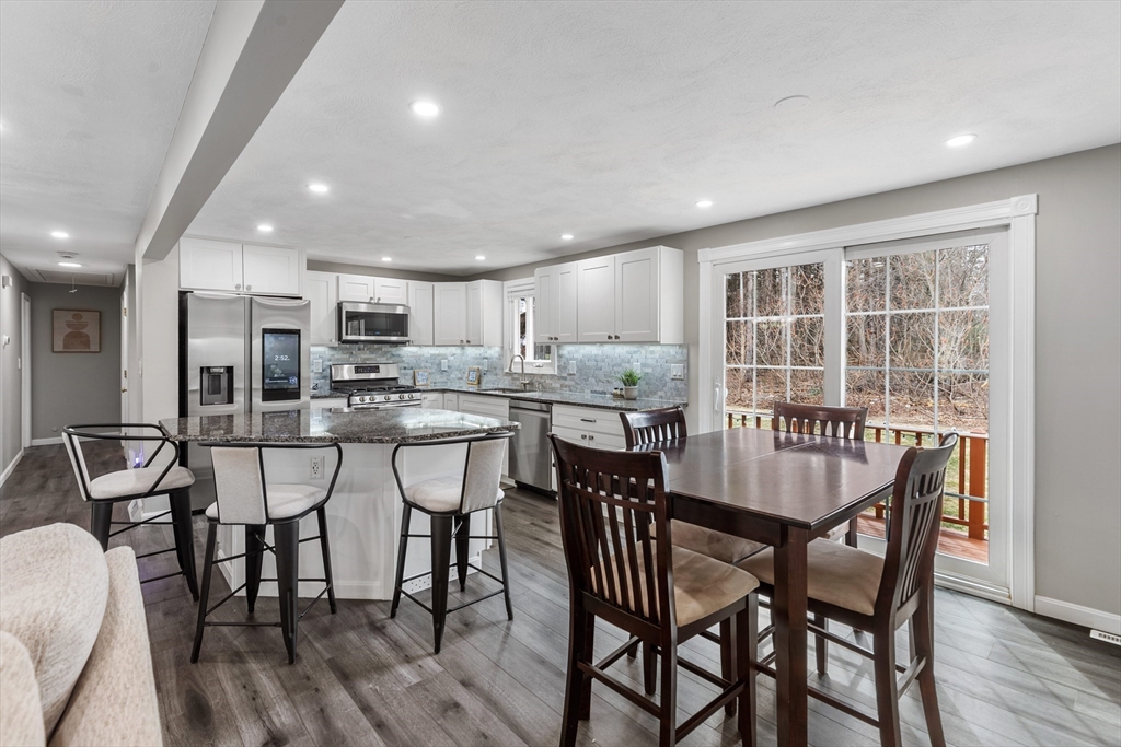 16 Bear Hill Road Billerica, MA 01821 - Photo 2 of 28 a dining room with furniture and wooden floor
