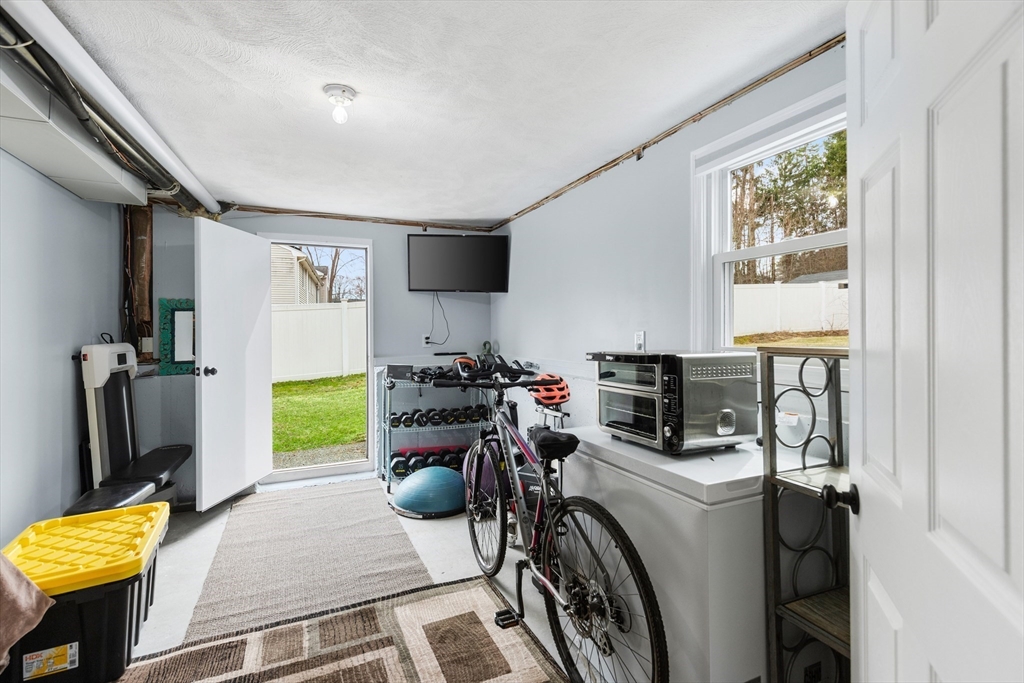 16 Bear Hill Road Billerica, MA 01821 - Photo 22 of 28 a view of a workspace with furniture and a window