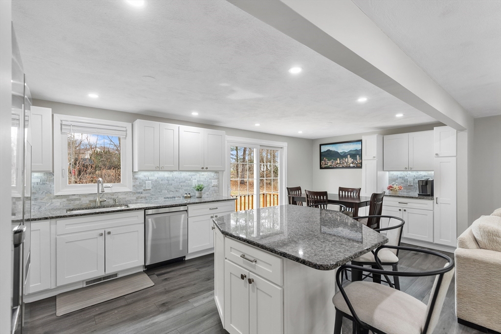 16 Bear Hill Road Billerica, MA 01821 - Photo 4 of 28 a kitchen with granite countertop a sink and cabinets