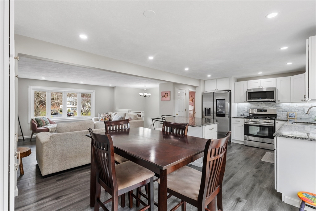 16 Bear Hill Road Billerica, MA 01821 - Photo 7 of 28 a view of a dining room with furniture and wooden floor