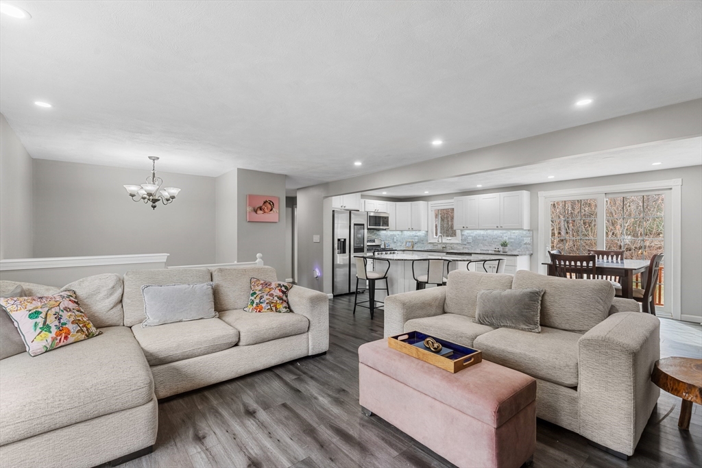 16 Bear Hill Road Billerica, MA 01821 - Photo 9 of 28 a living room with furniture and a large window