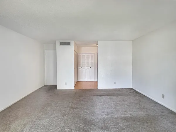 a bathroom with a shower and a sink