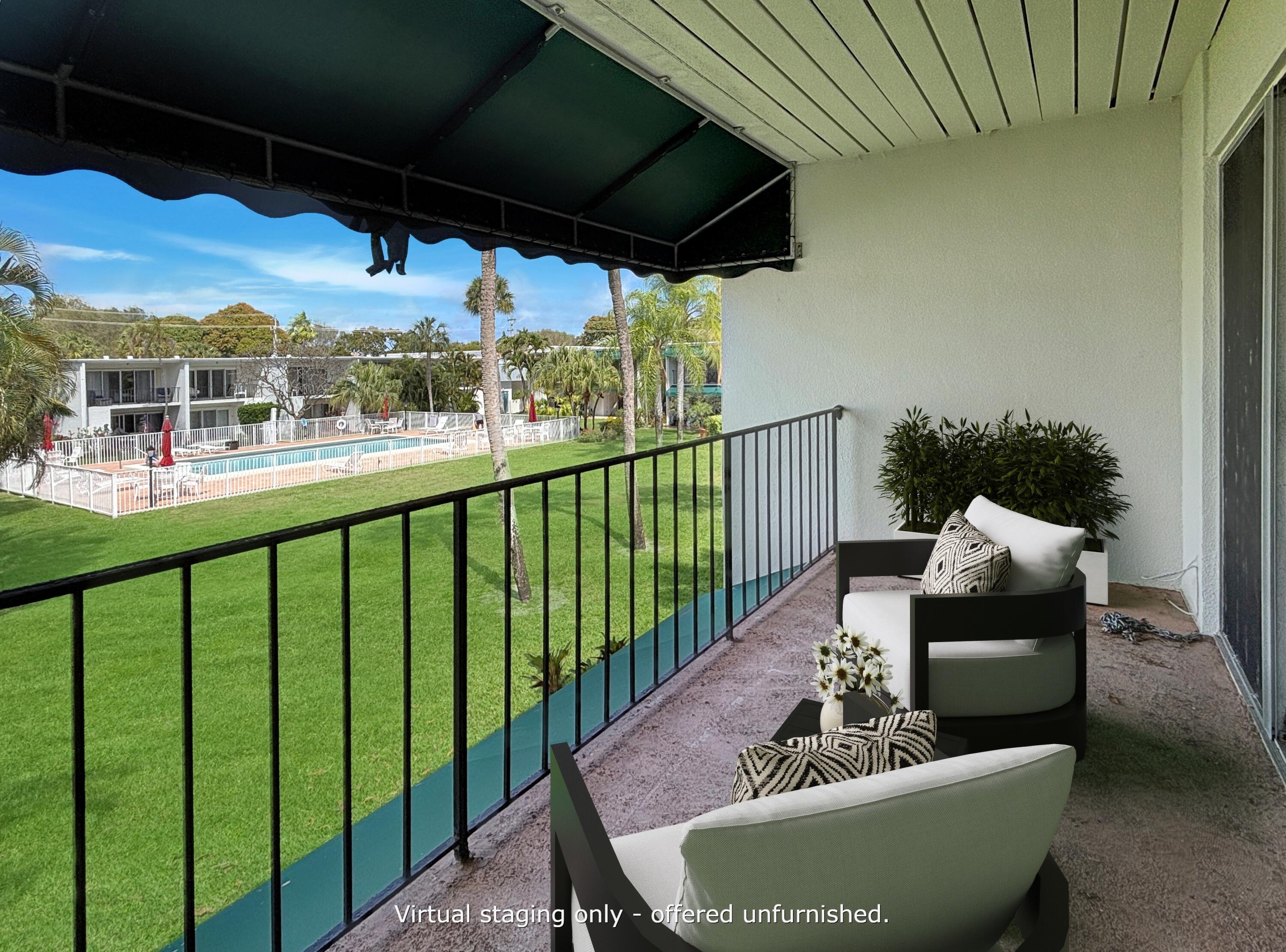 390 Golfview Road, Unit I North Palm Beach, FL 33408 - Photo 15 of 34 a view of a porch with furniture