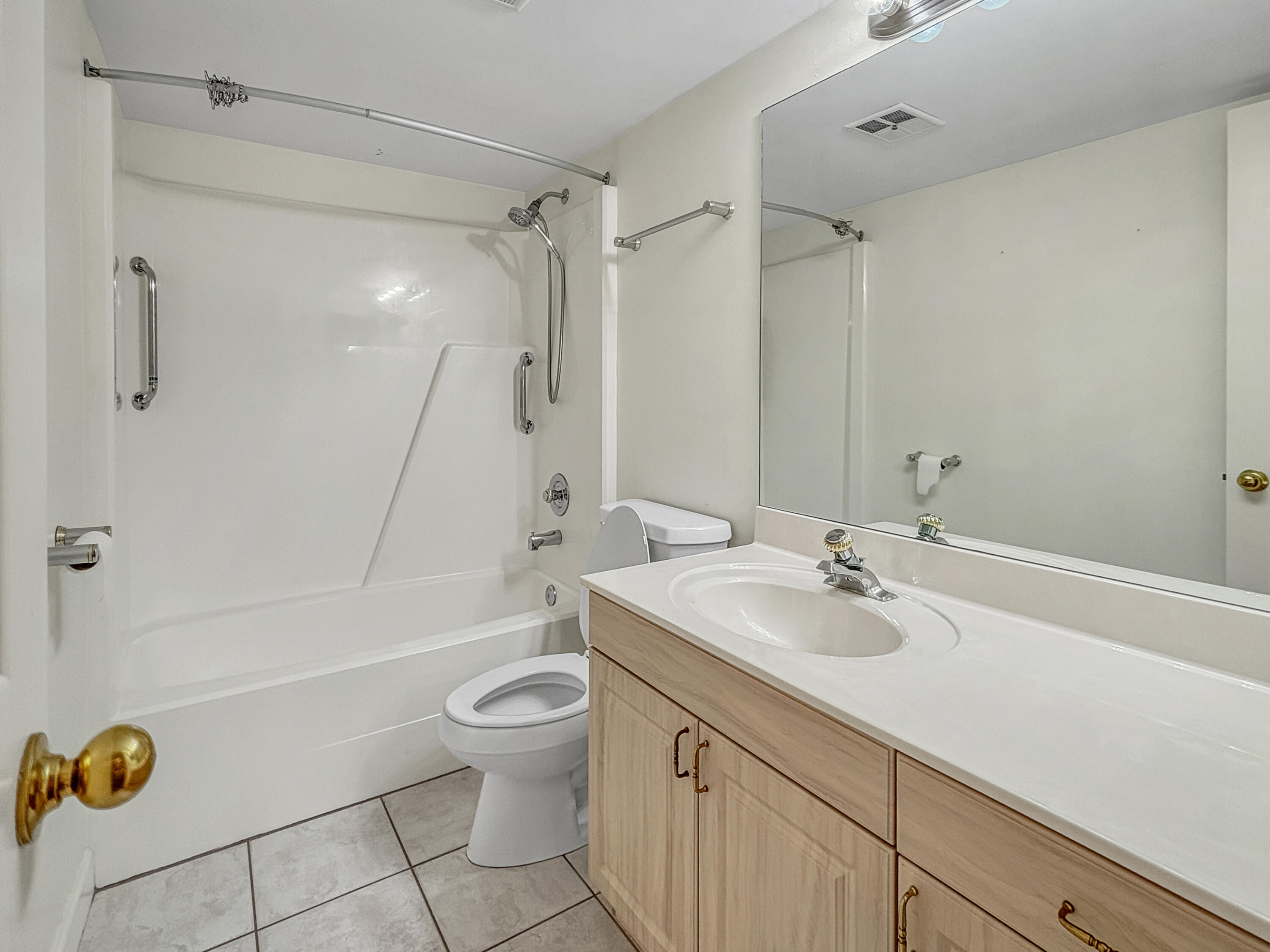 390 Golfview Road, Unit I North Palm Beach, FL 33408 - Photo 18 of 34 a bathroom with a sink a toilet and shower