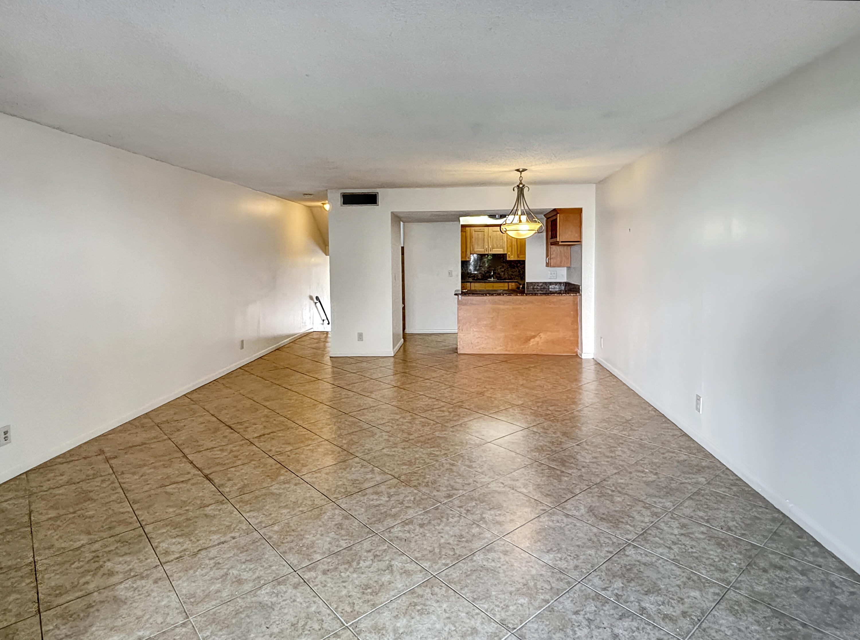 390 Golfview Road, Unit I North Palm Beach, FL 33408 - Photo 3 of 34 a view of empty room with wooden floor