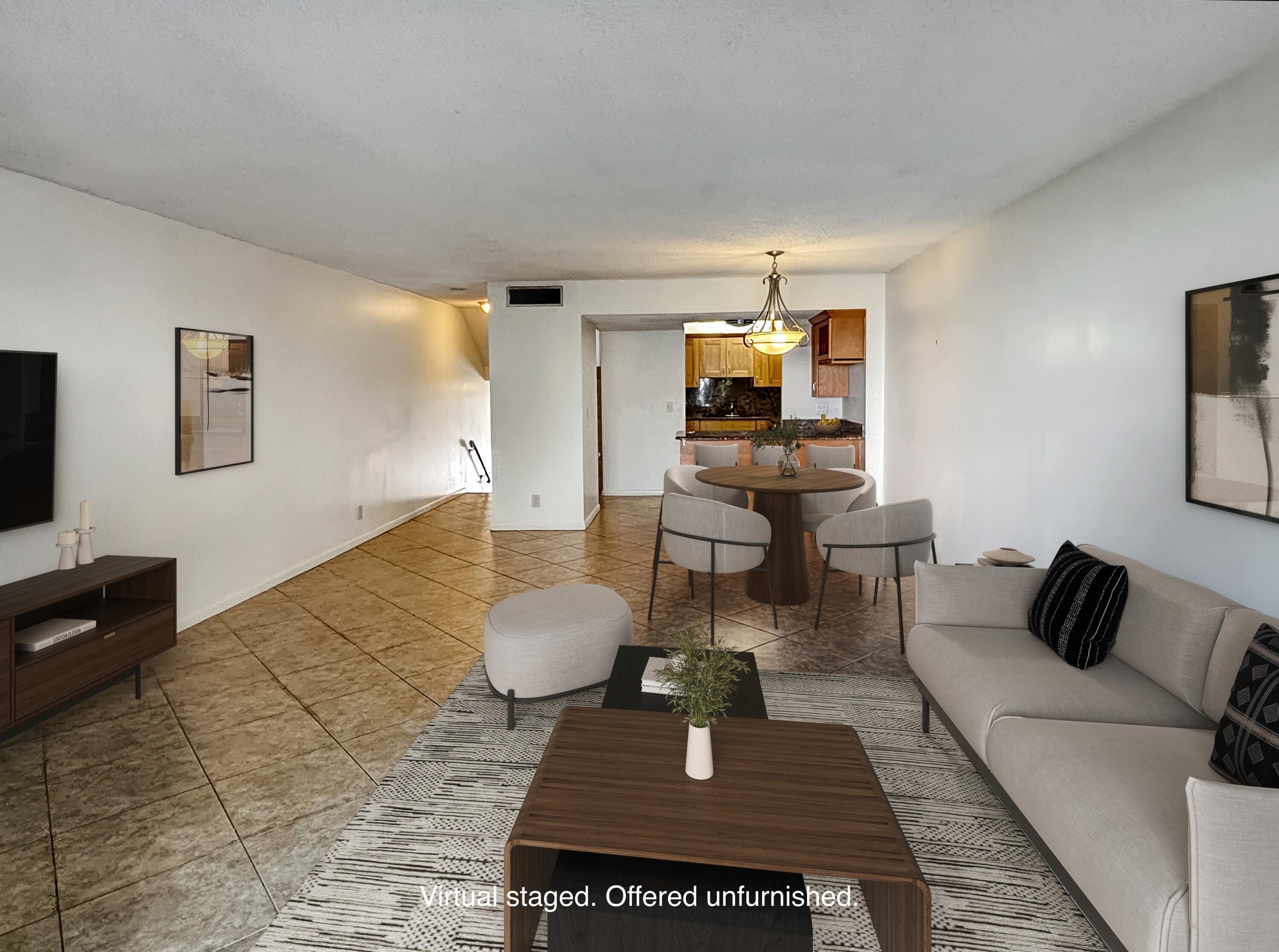 390 Golfview Road, Unit I North Palm Beach, FL 33408 - Photo 4 of 34 a living room with furniture and a flat screen tv