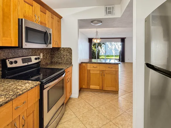 a kitchen with a stove and a microwave