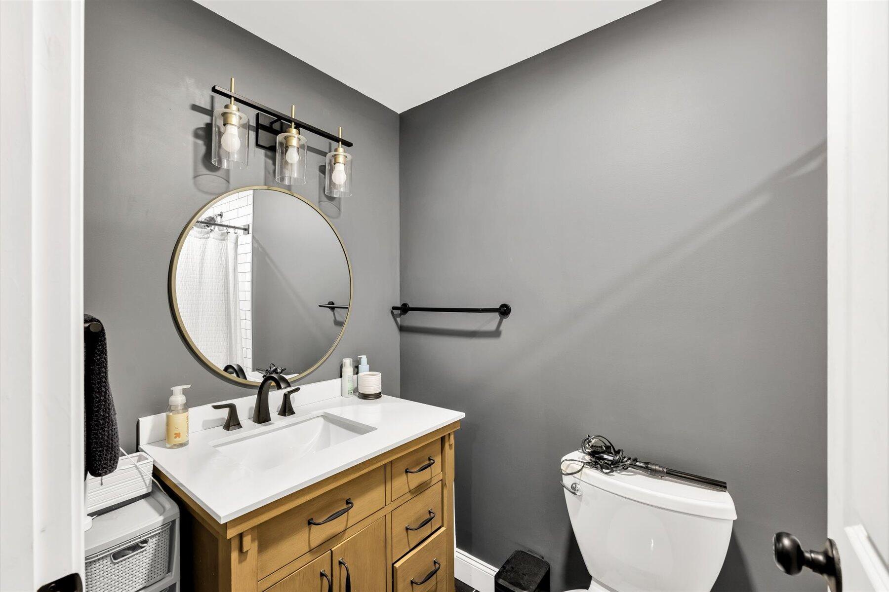 1562 State Hwy Route Eastham, MA 02642 - Photo 12 of 31 a bathroom with a toilet a sink and mirror