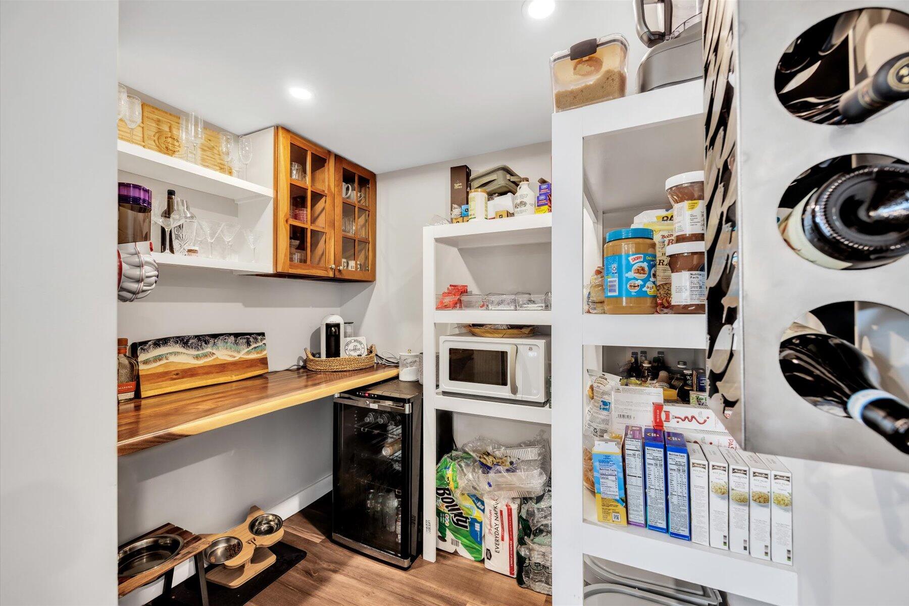 1562 State Hwy Route Eastham, MA 02642 - Photo 18 of 31 a utility room with stainless steel appliances and a wooden floor