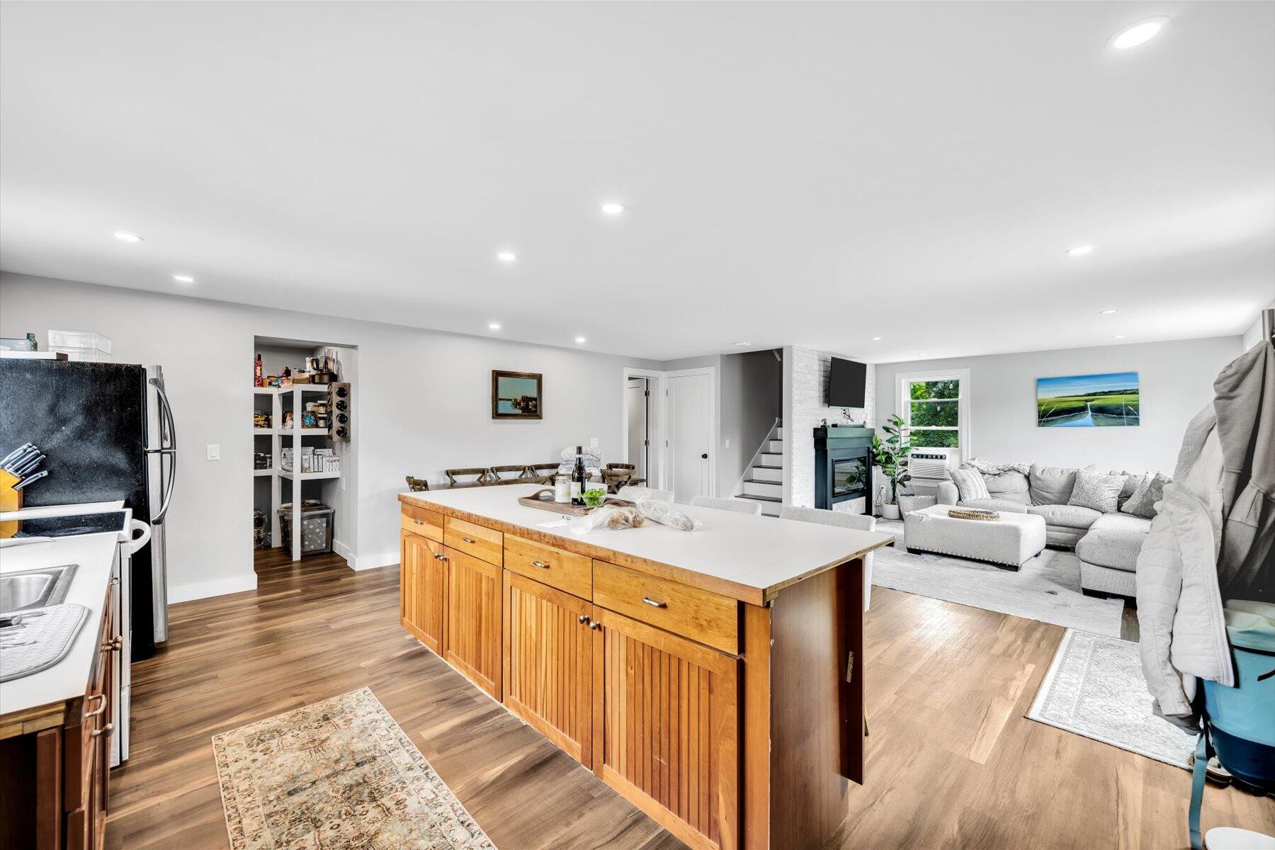 1562 State Hwy Route Eastham, MA 02642 - Photo 21 of 31 a large living room with stainless steel appliances granite countertop a couch and a view of living room
