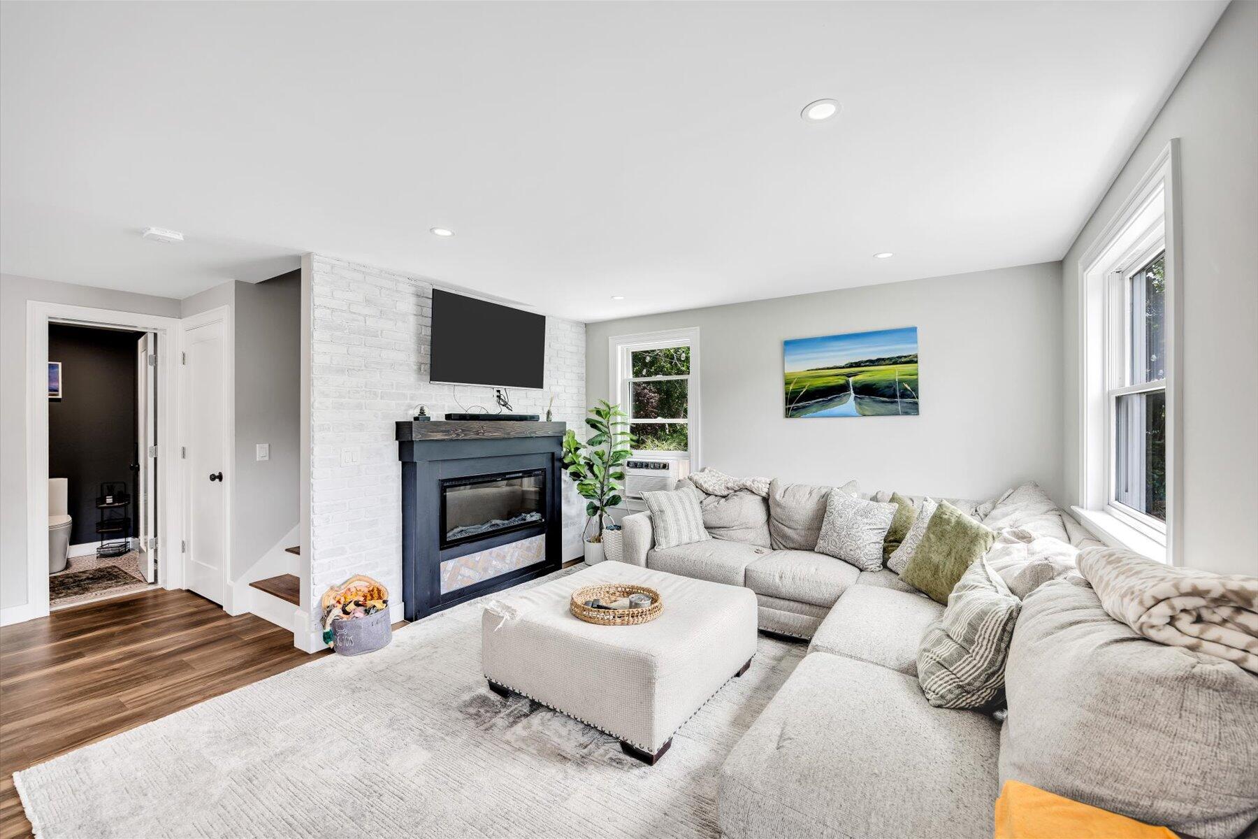 1562 State Hwy Route Eastham, MA 02642 - Photo 25 of 31 a living room with furniture and a flat screen tv