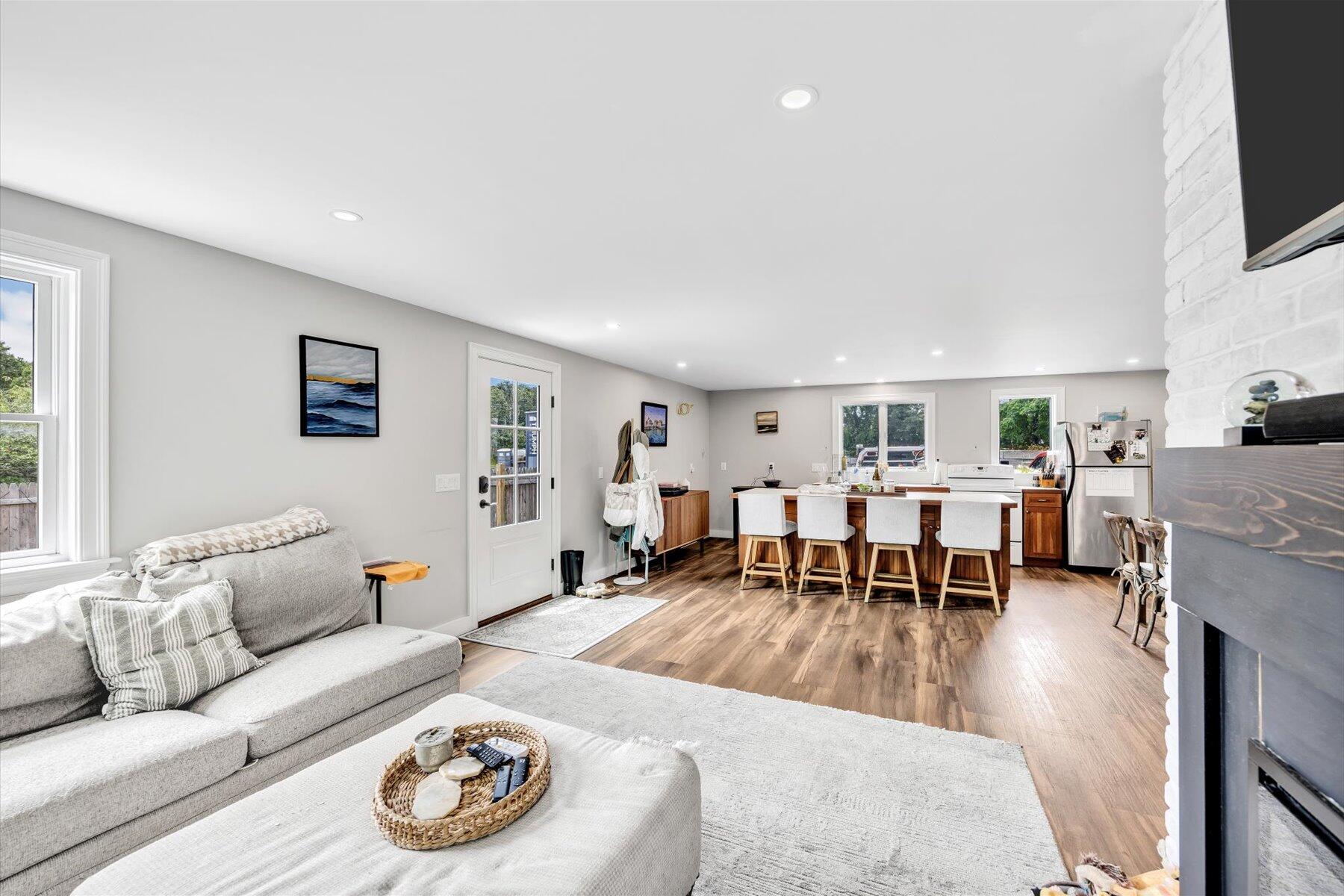 1562 State Hwy Route Eastham, MA 02642 - Photo 26 of 31 a living room with furniture and a flat screen tv