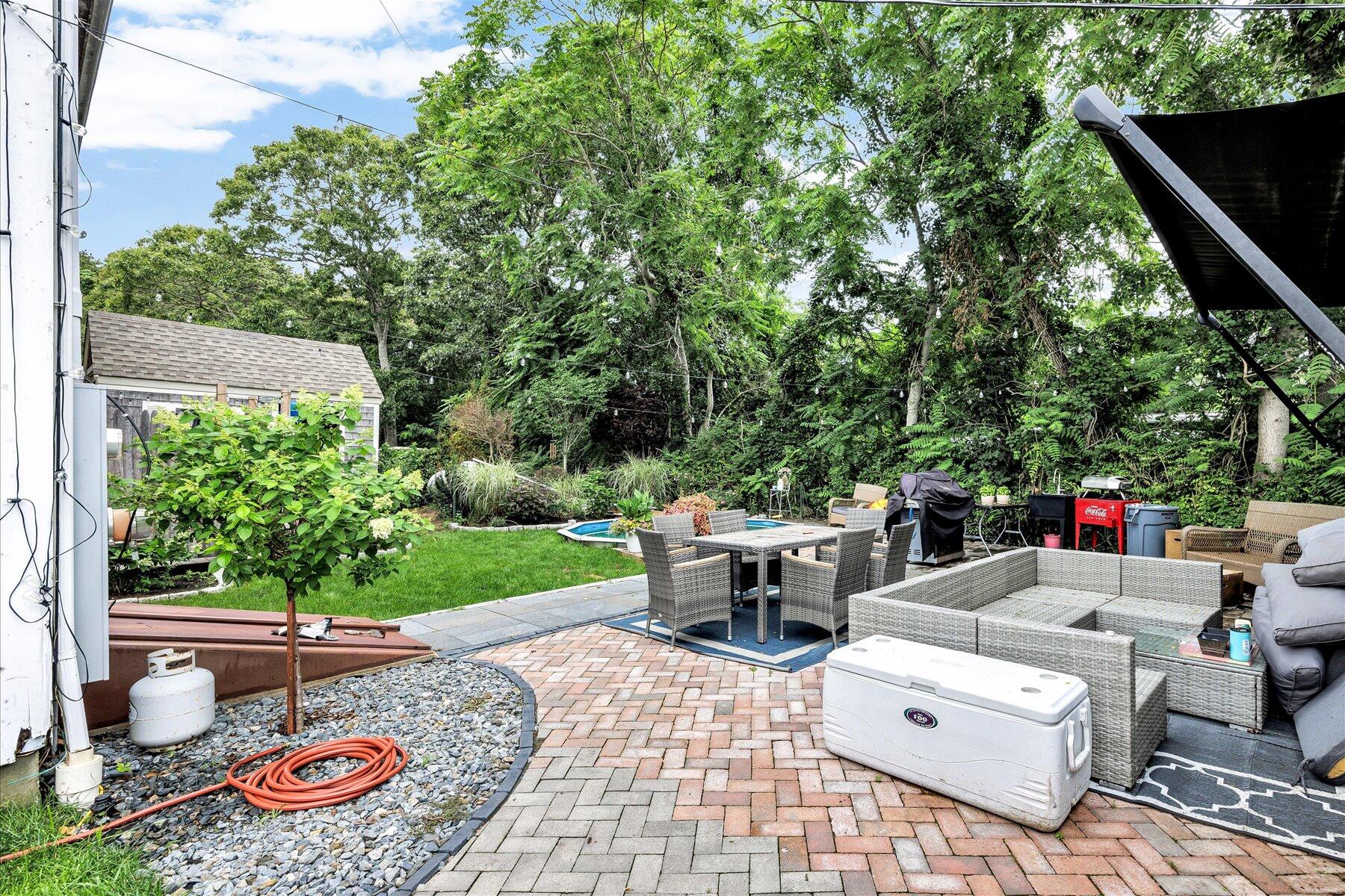 1562 State Hwy Route Eastham, MA 02642 - Photo 5 of 31 a view of a patio with chairs and potted plants