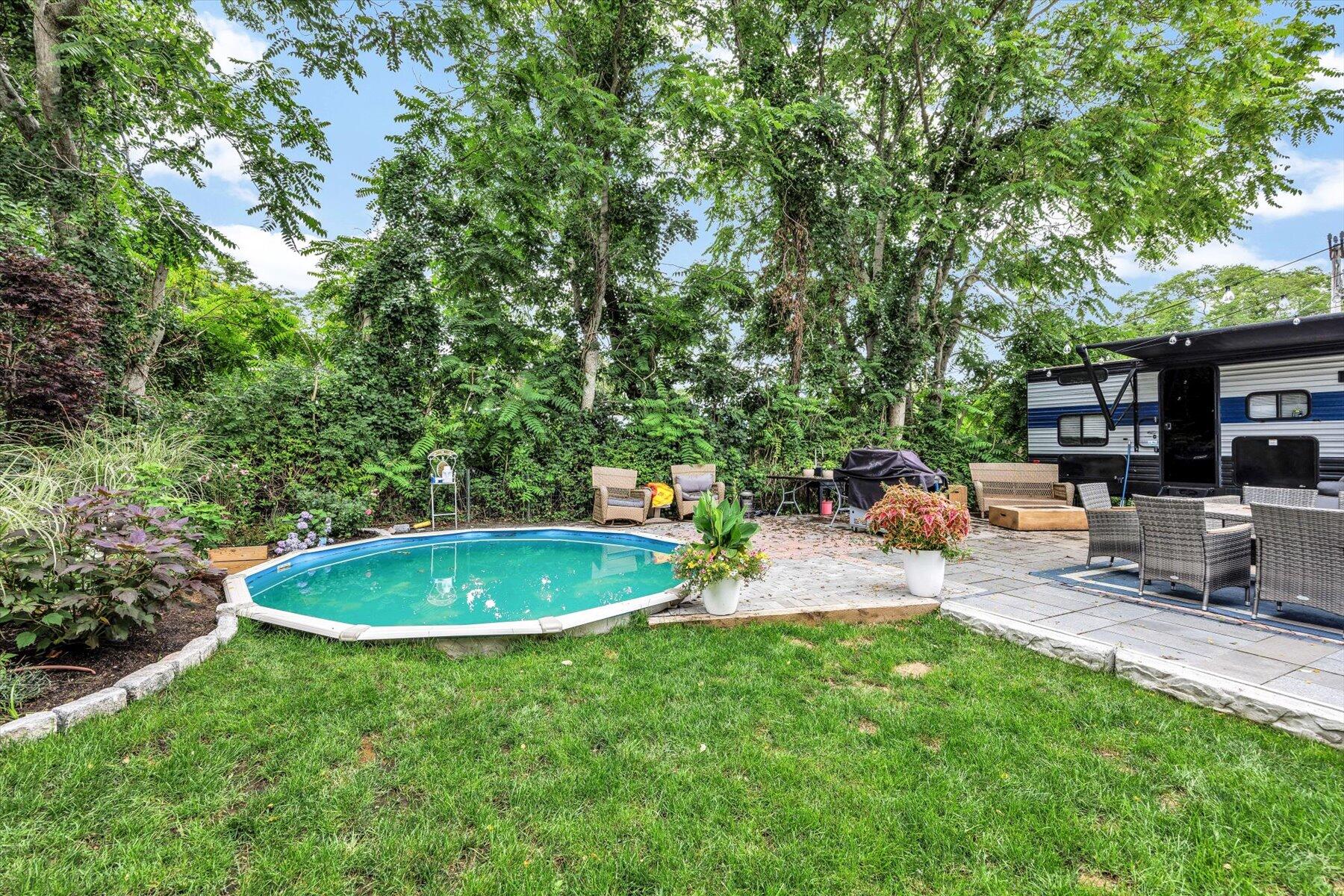 1562 State Hwy Route Eastham, MA 02642 - Photo 8 of 31 a backyard of a house with table and chairs