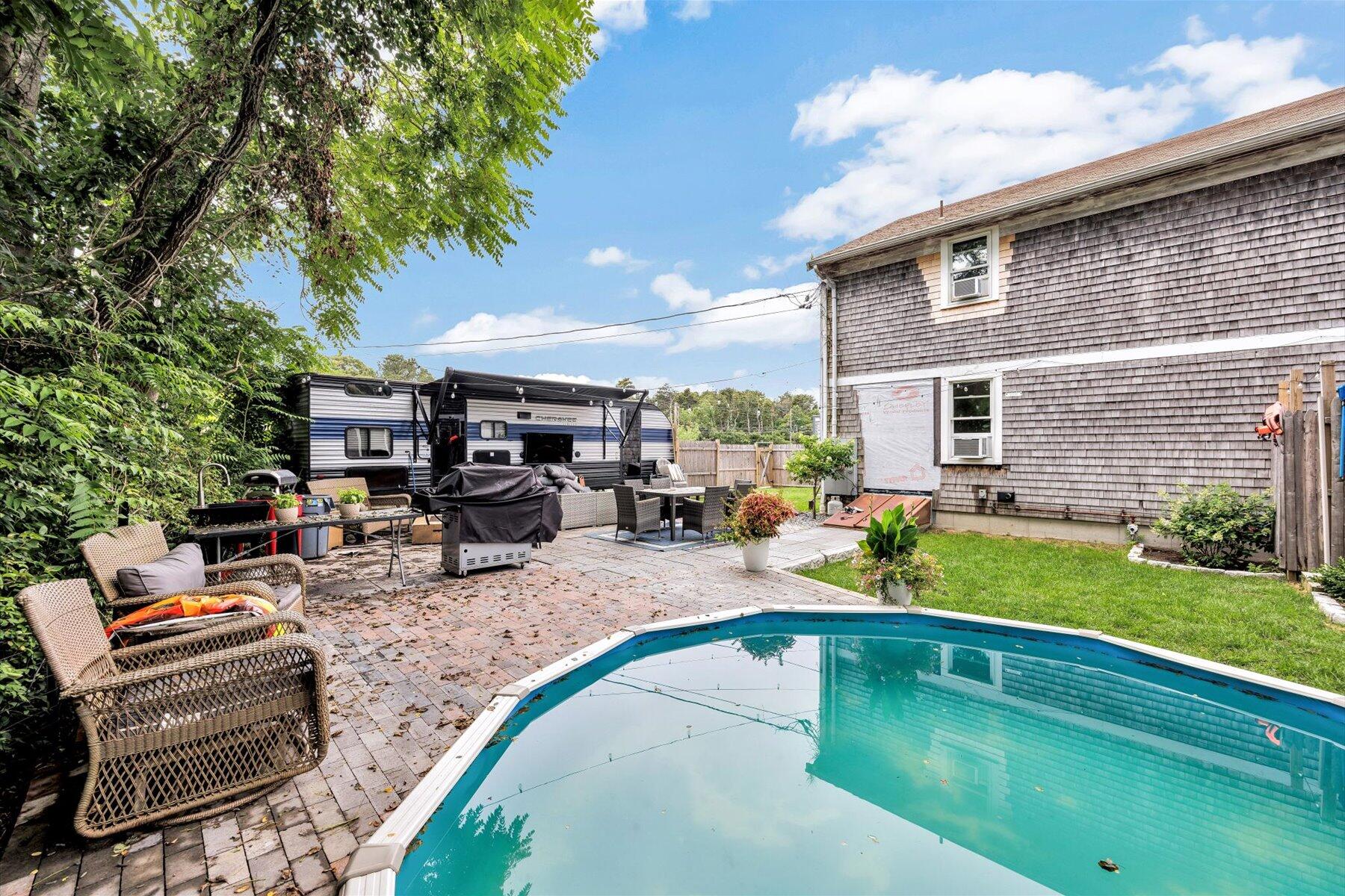 1562 State Hwy Route Eastham, MA 02642 - Photo 9 of 31 a view of a house with backyard porch and sitting area