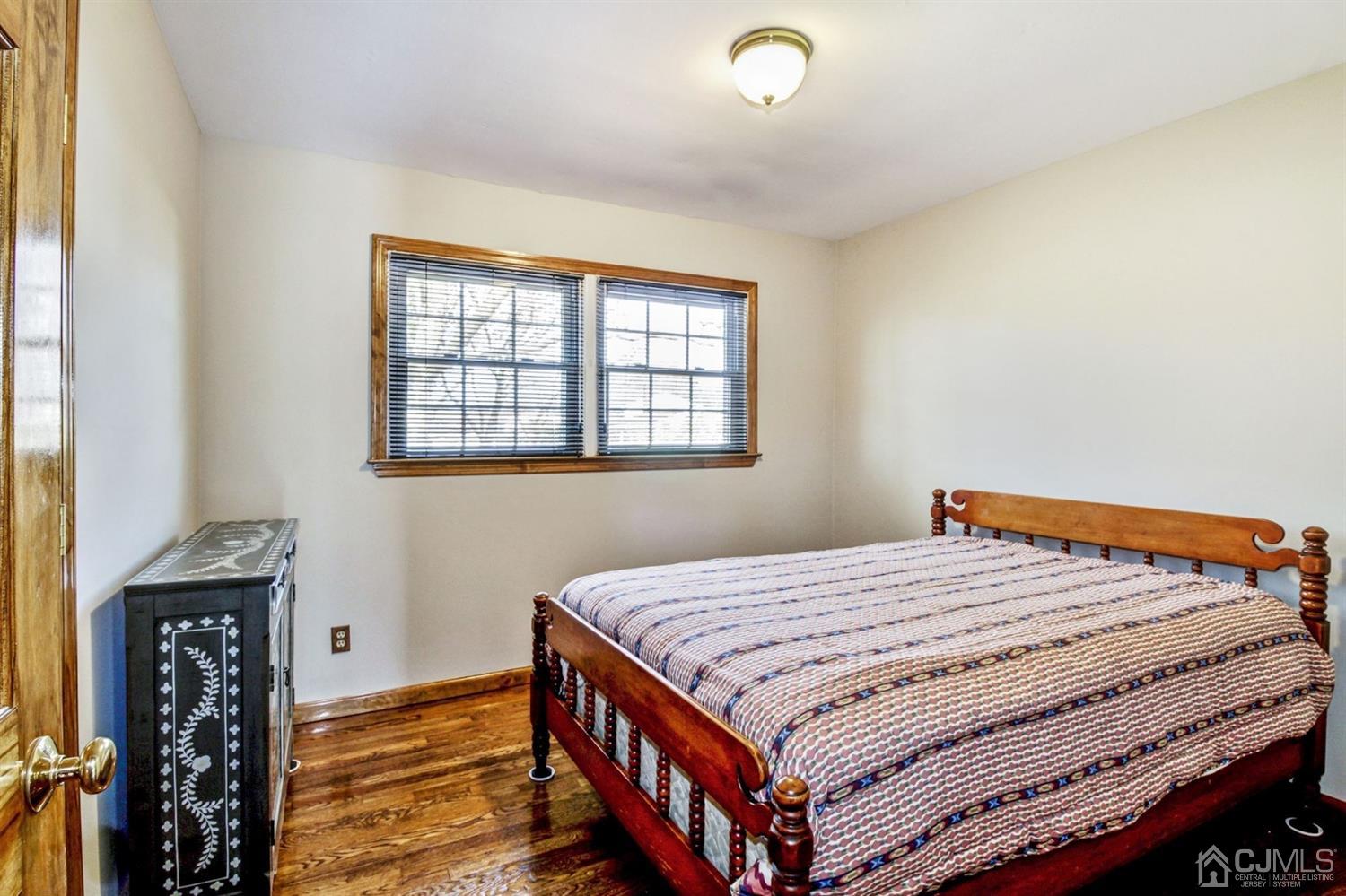 35 Rieder Road Edison, NJ 08817 - Photo 11 of 25 a bedroom with a bed and a window