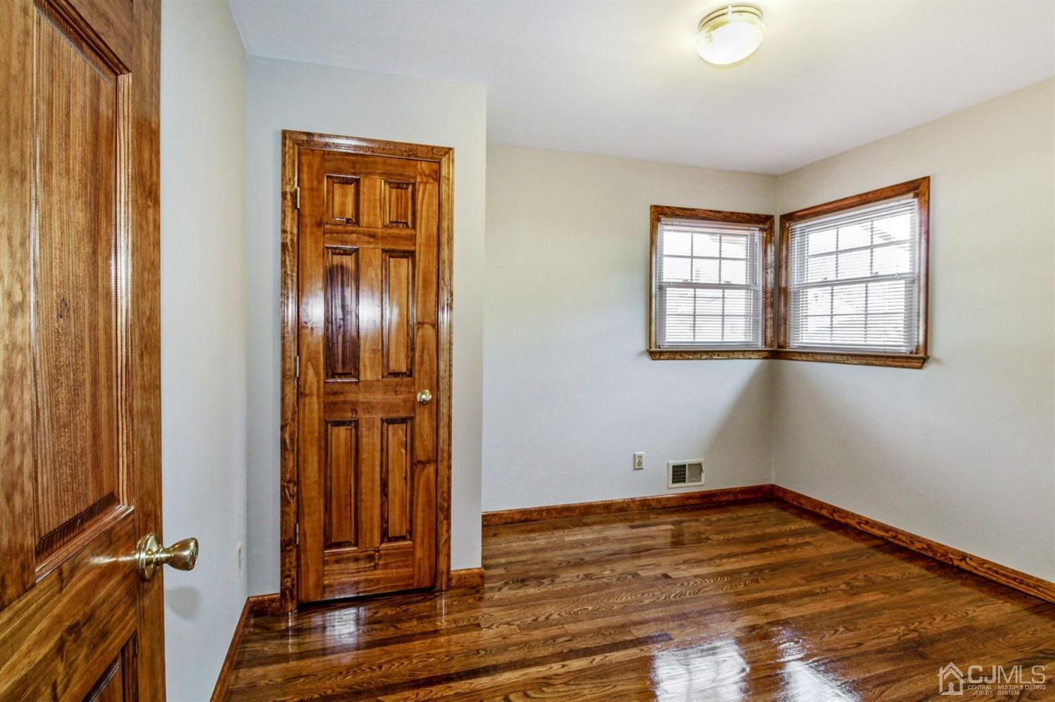 35 Rieder Road Edison, NJ 08817 - Photo 13 of 25 an empty room with wooden floor and windows