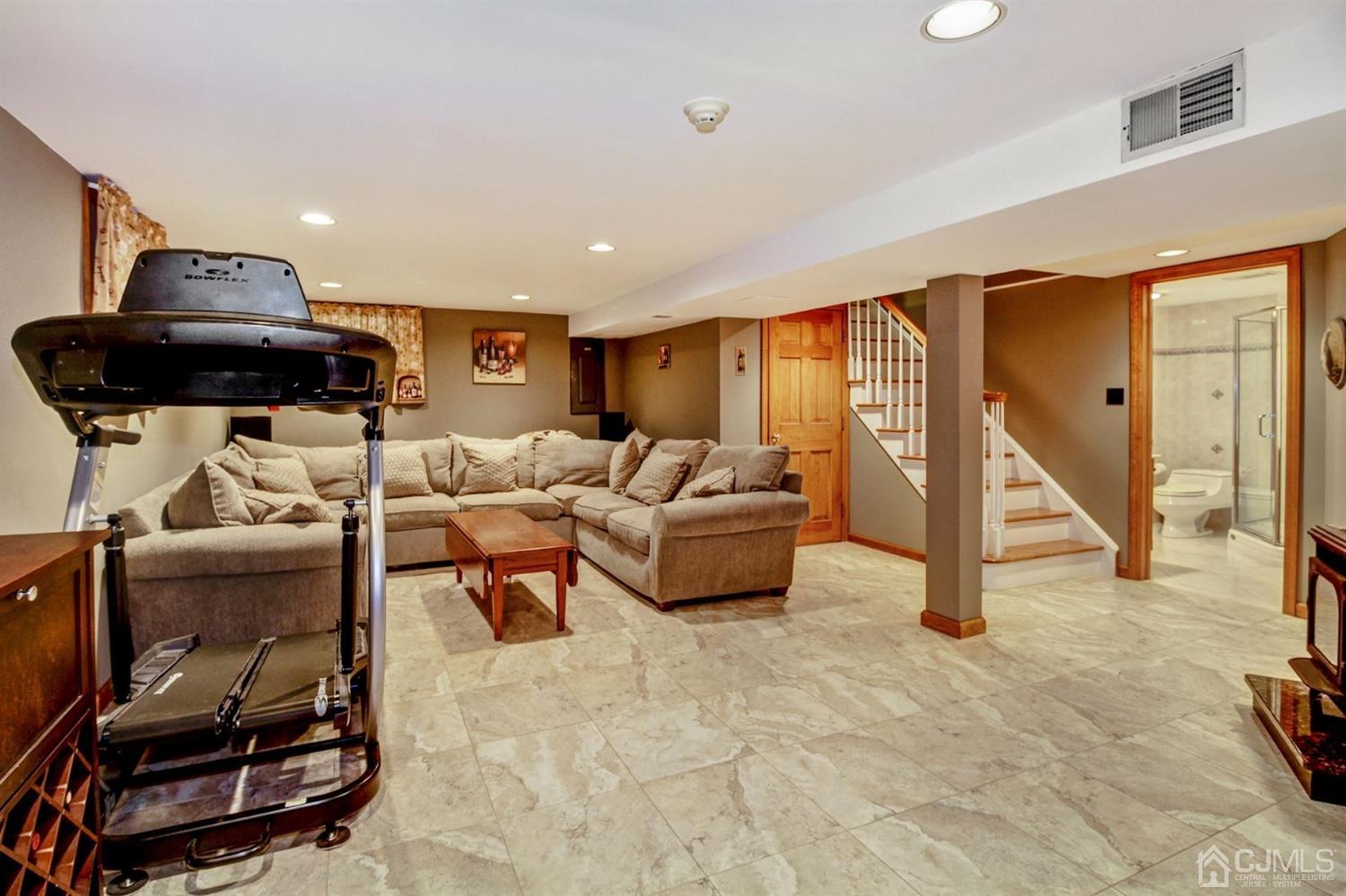 35 Rieder Road Edison, NJ 08817 - Photo 15 of 25 a living room with furniture and a flat screen tv