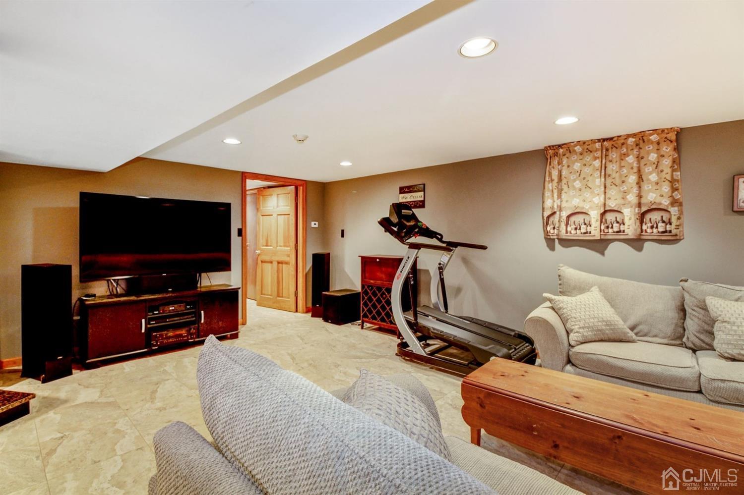 35 Rieder Road Edison, NJ 08817 - Photo 16 of 25 a living room with furniture and a flat screen tv