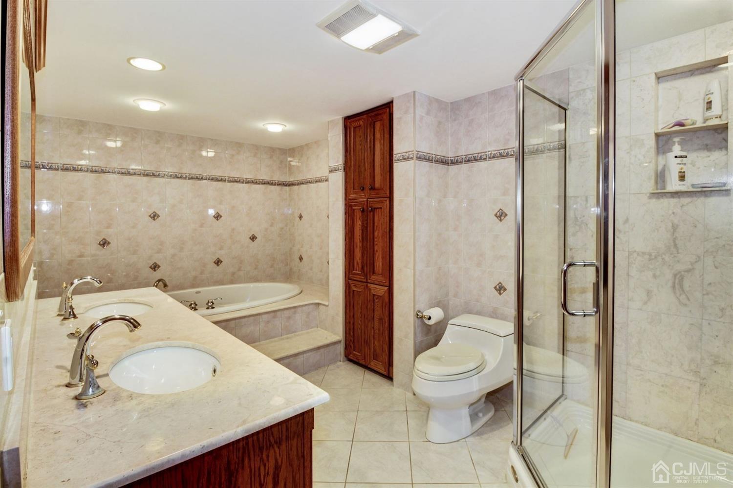 35 Rieder Road Edison, NJ 08817 - Photo 21 of 25 a bathroom with a granite countertop sink toilet and shower