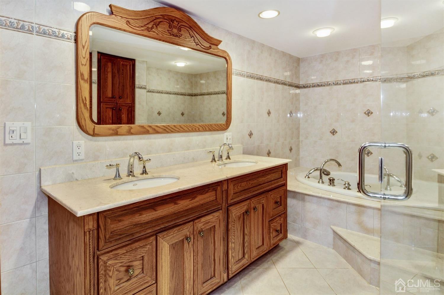 35 Rieder Road Edison, NJ 08817 - Photo 22 of 25 a bathroom with a sink double vanity and a mirror
