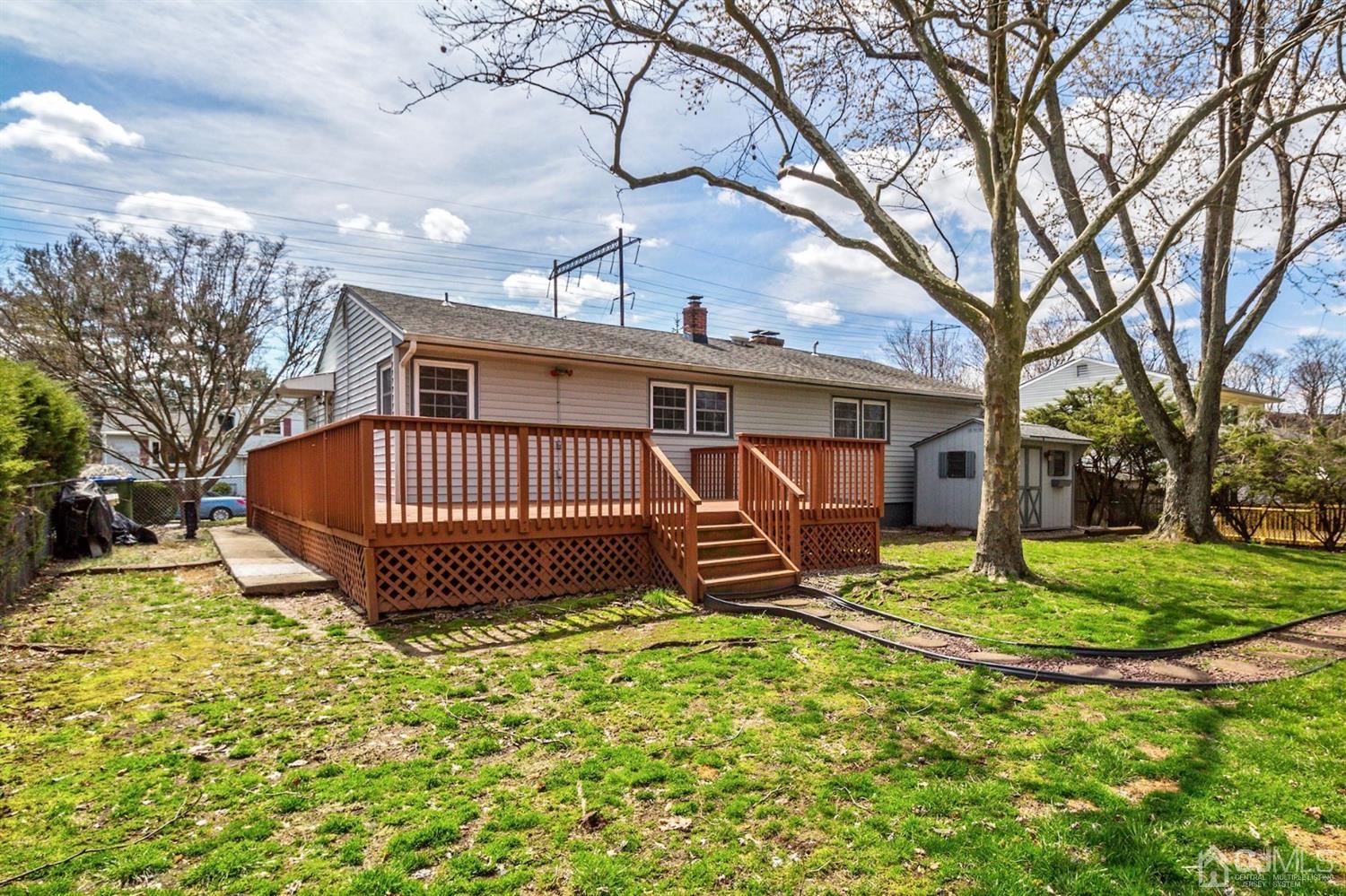 35 Rieder Road Edison, NJ 08817 - Photo 23 of 25 a view of a house with backyard and a tree