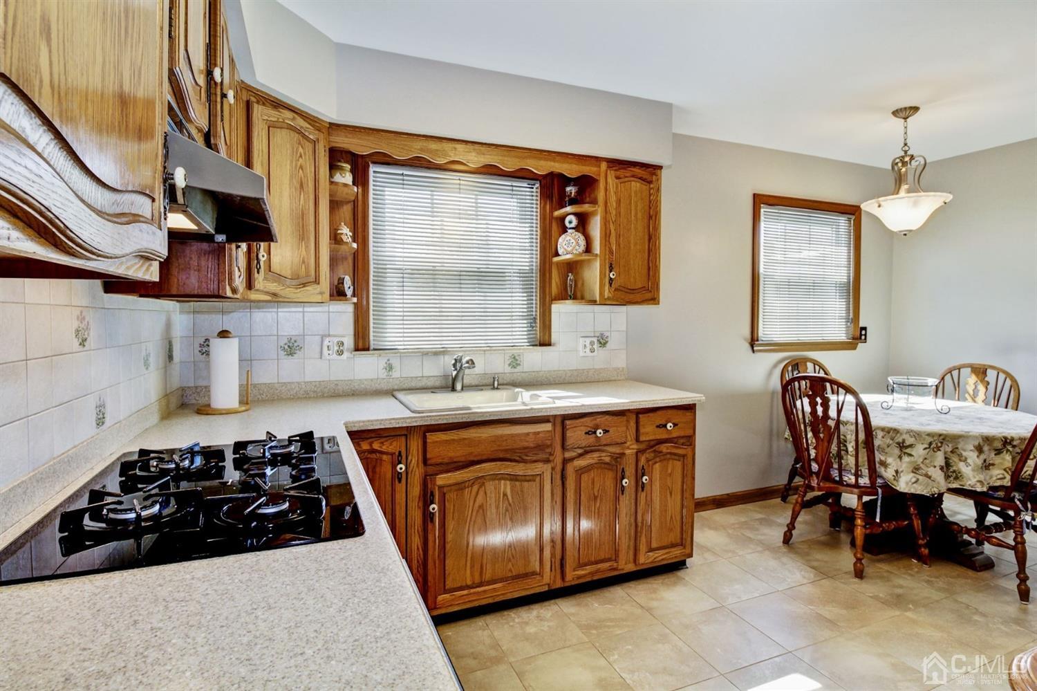 35 Rieder Road Edison, NJ 08817 - Photo 7 of 25 a kitchen with stainless steel appliances a sink and a stove