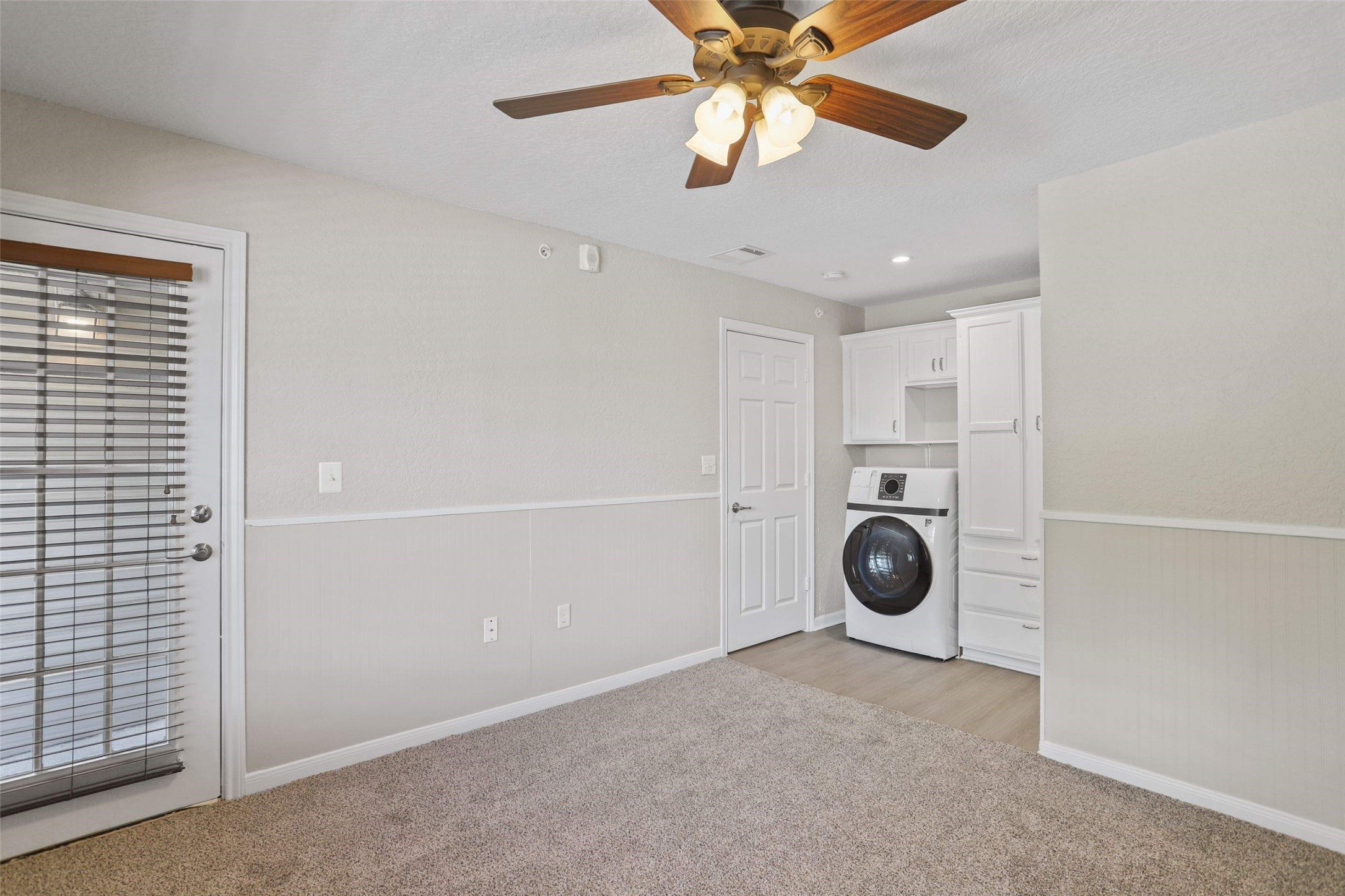11700 League Line Road, Unit 122 Conroe, TX 77304 - Photo 11 of 25 a view of a storage & utility room with washer and dryer