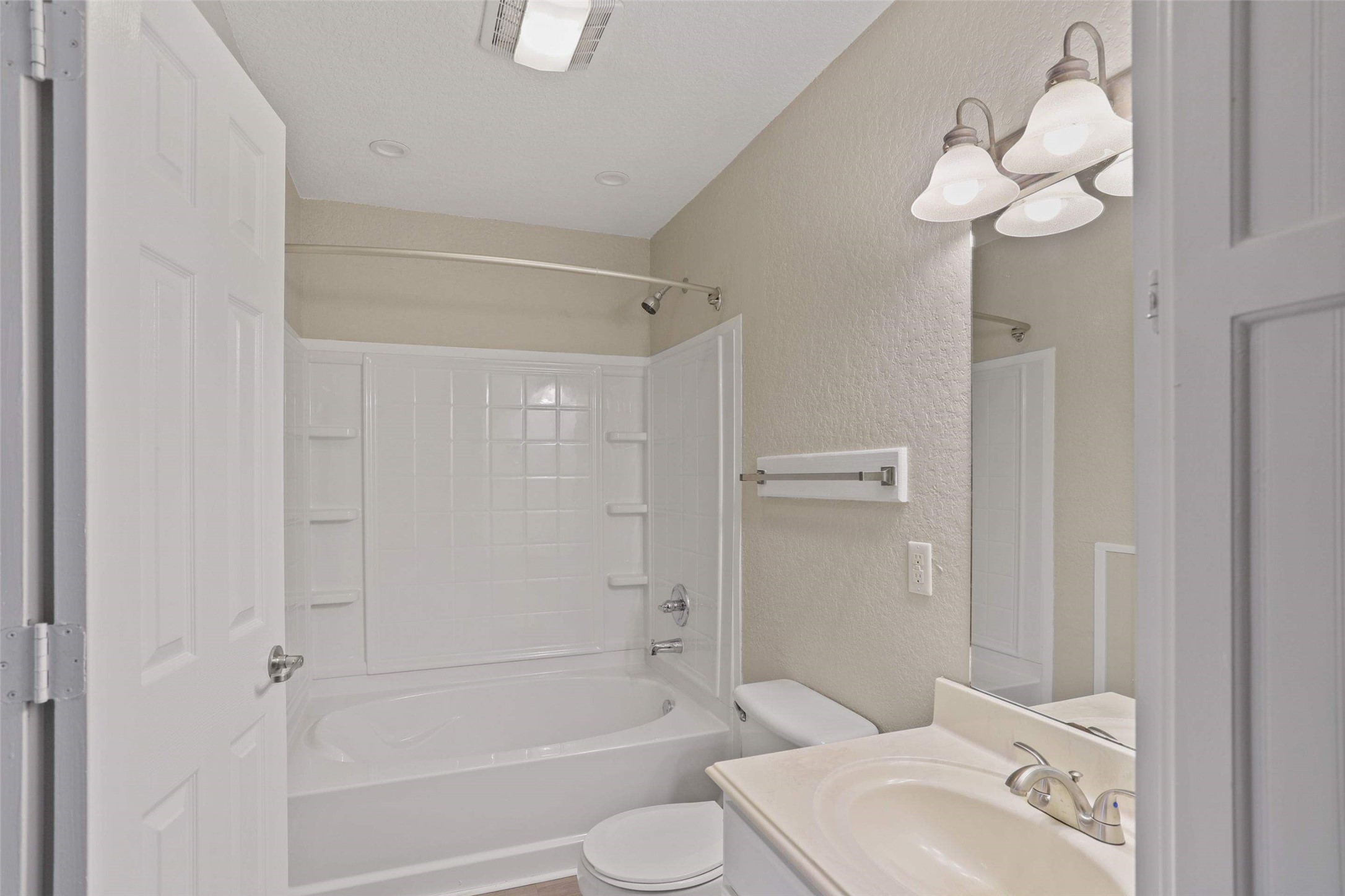 11700 League Line Road, Unit 122 Conroe, TX 77304 - Photo 5 of 25 a bathroom with a sink a toilet and shower