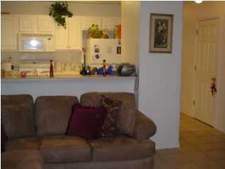 497 Keystone Road, Unit 497 Mary Esther, FL 32569 - Photo 3 of 3 a living room with furniture and a mirror