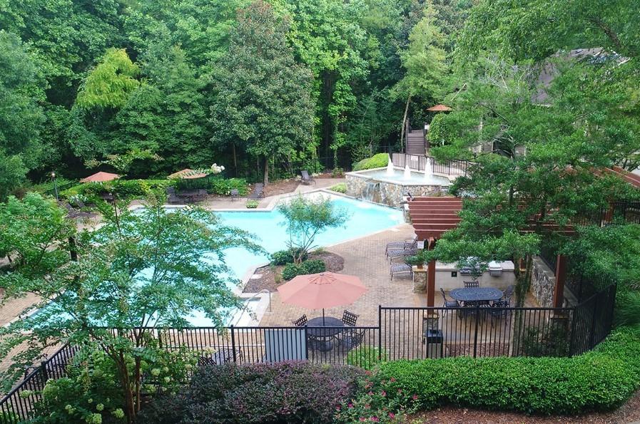 3450 K Jones Mill Road, Unit 218 Norcross, GA 30092 - Photo 23 of 29 an aerial view of a house with outdoor space and garden