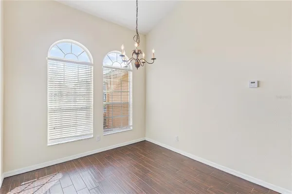 a kitchen with stainless steel appliances granite countertop a sink counter space cabinets and a stove