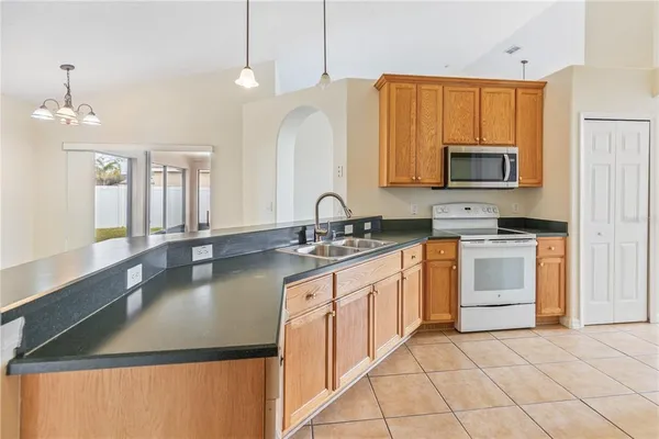 a view of an empty room with glass door