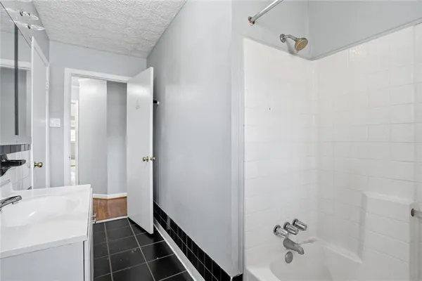 a bathroom with a sink and a shower