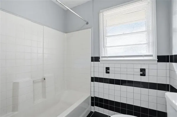 a bathroom with a shower and a bathtub