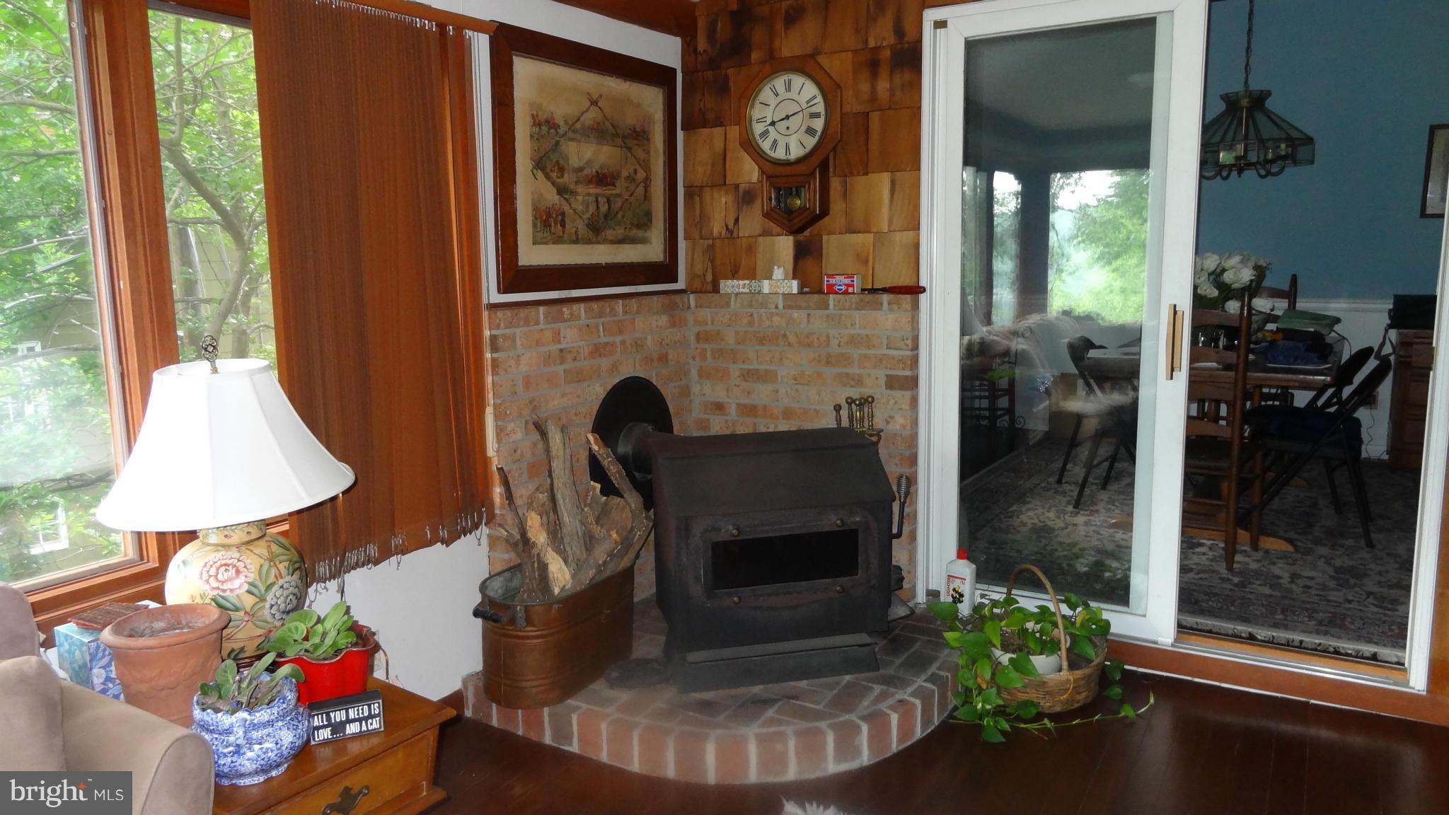 704 Robin Hood Road Annapolis, MD 21405 - Photo 15 of 30 Sun room with Wood Stove