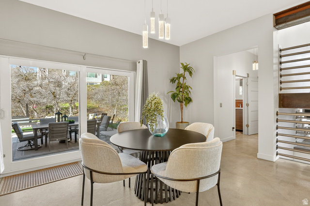 14902 Saddle Leaf Court Draper, UT 84020 - Photo 18 of 52 Dining room featuring concrete flooring and baseboards