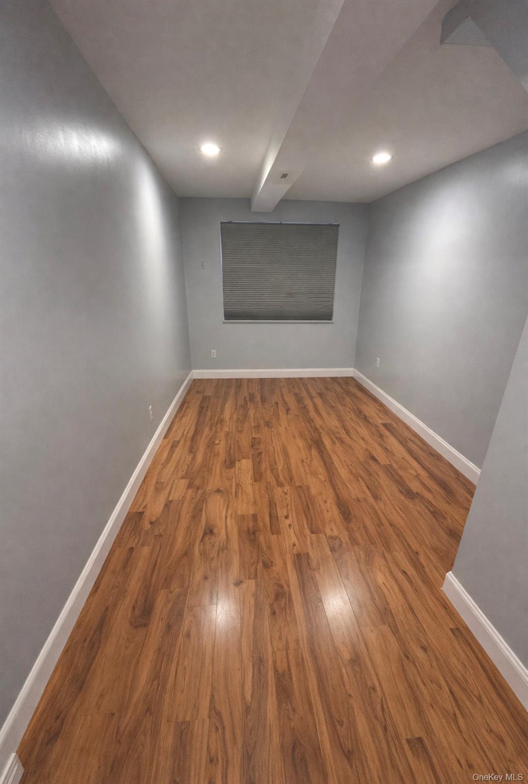 227 Calhoun Avenue Bronx, NY 10465 - Photo 3 of 17 a view of empty room with wooden floor