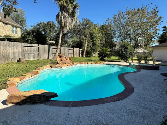 a view of a swimming pool with an outdoor space