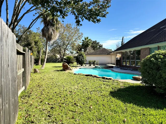 a garden view with a fountain