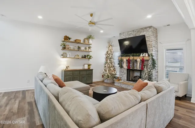 a living room with furniture and a flat screen tv