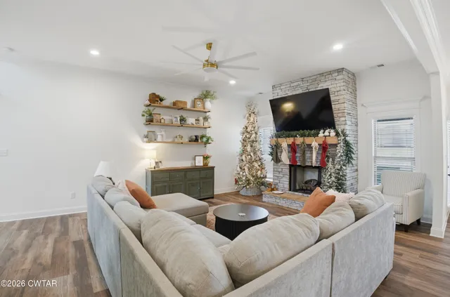 a living room with furniture and a flat screen tv
