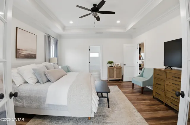 a bedroom with a bed and furniture