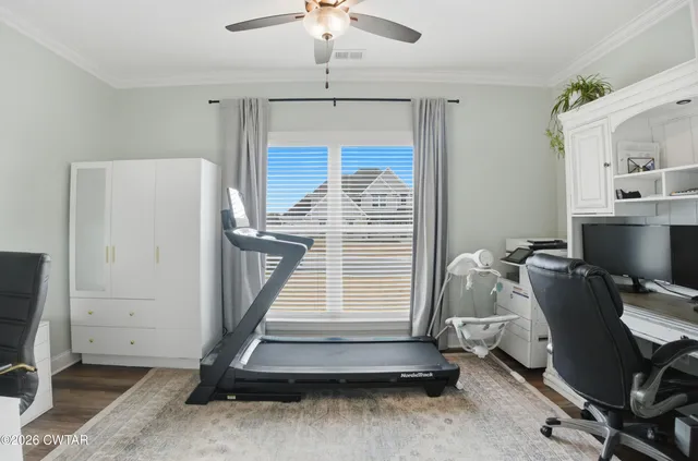 a room with gym equipment and a window