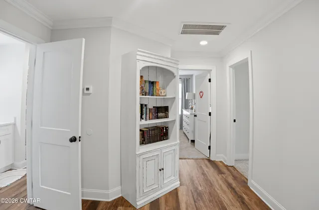 a bedroom with a bed and a view of bathroom