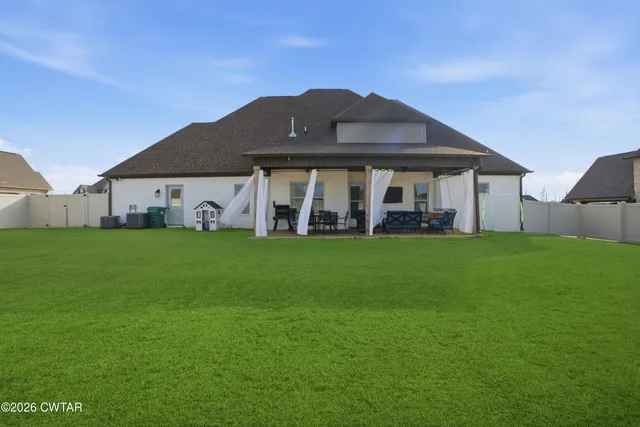 a view of a house with a big yard