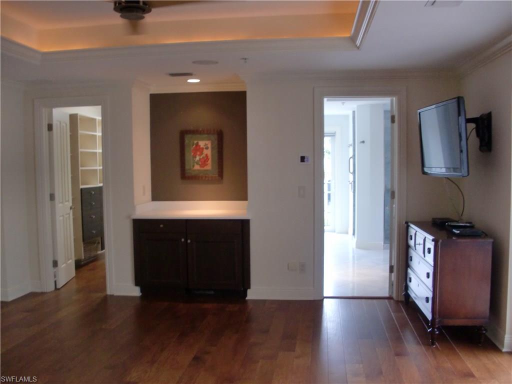 435 3rd Avenue South, Unit 3 Naples, FL 34102 - Photo 7 of 12 a view of an entryway with wooden floor