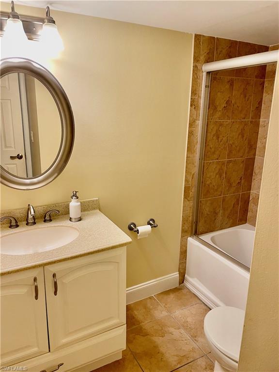 200 Palm Drive, Unit 7 Naples, FL 34112 - Photo 12 of 21 a bathroom with a sink and a mirror